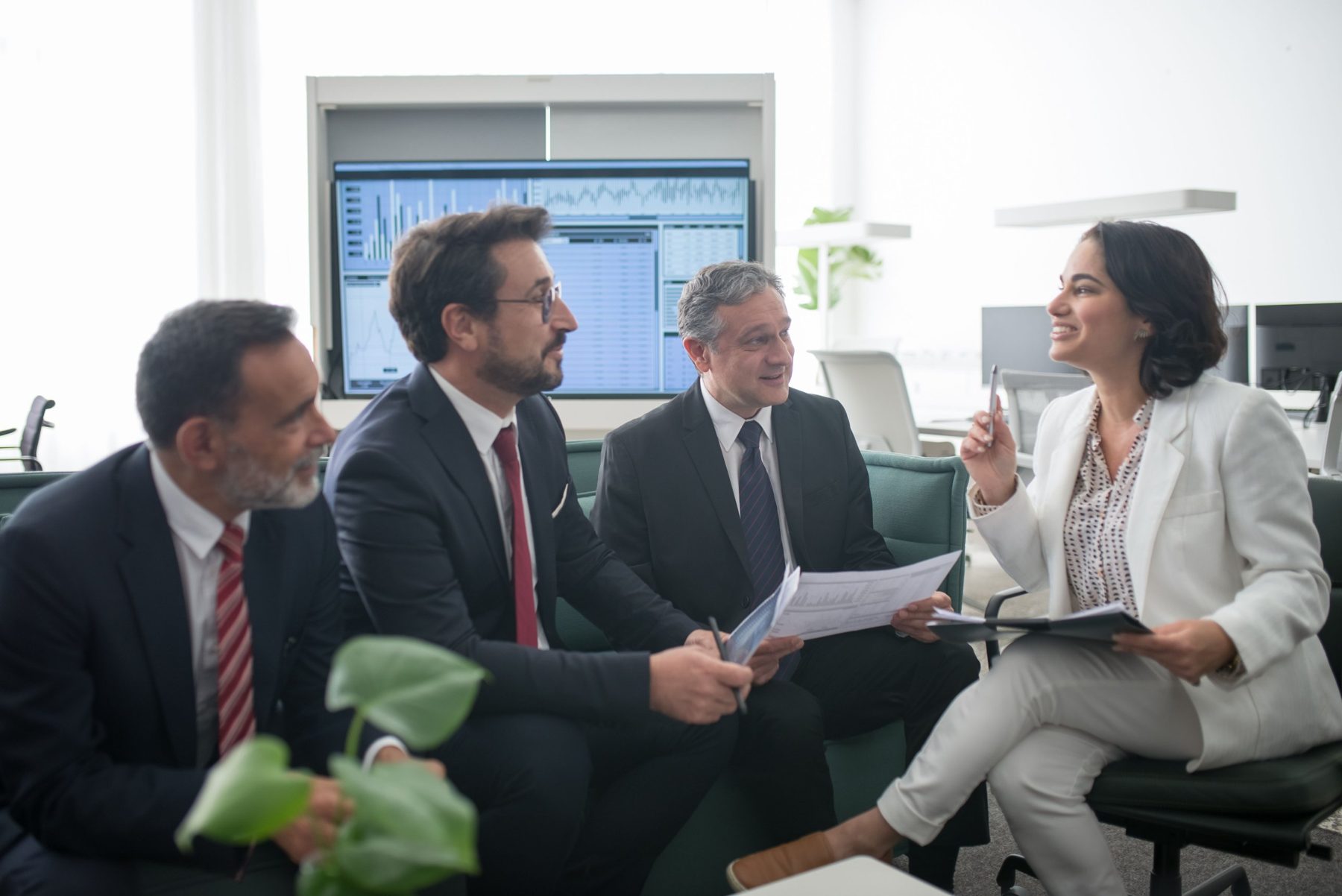 Colleagues talking around a table in a meeting