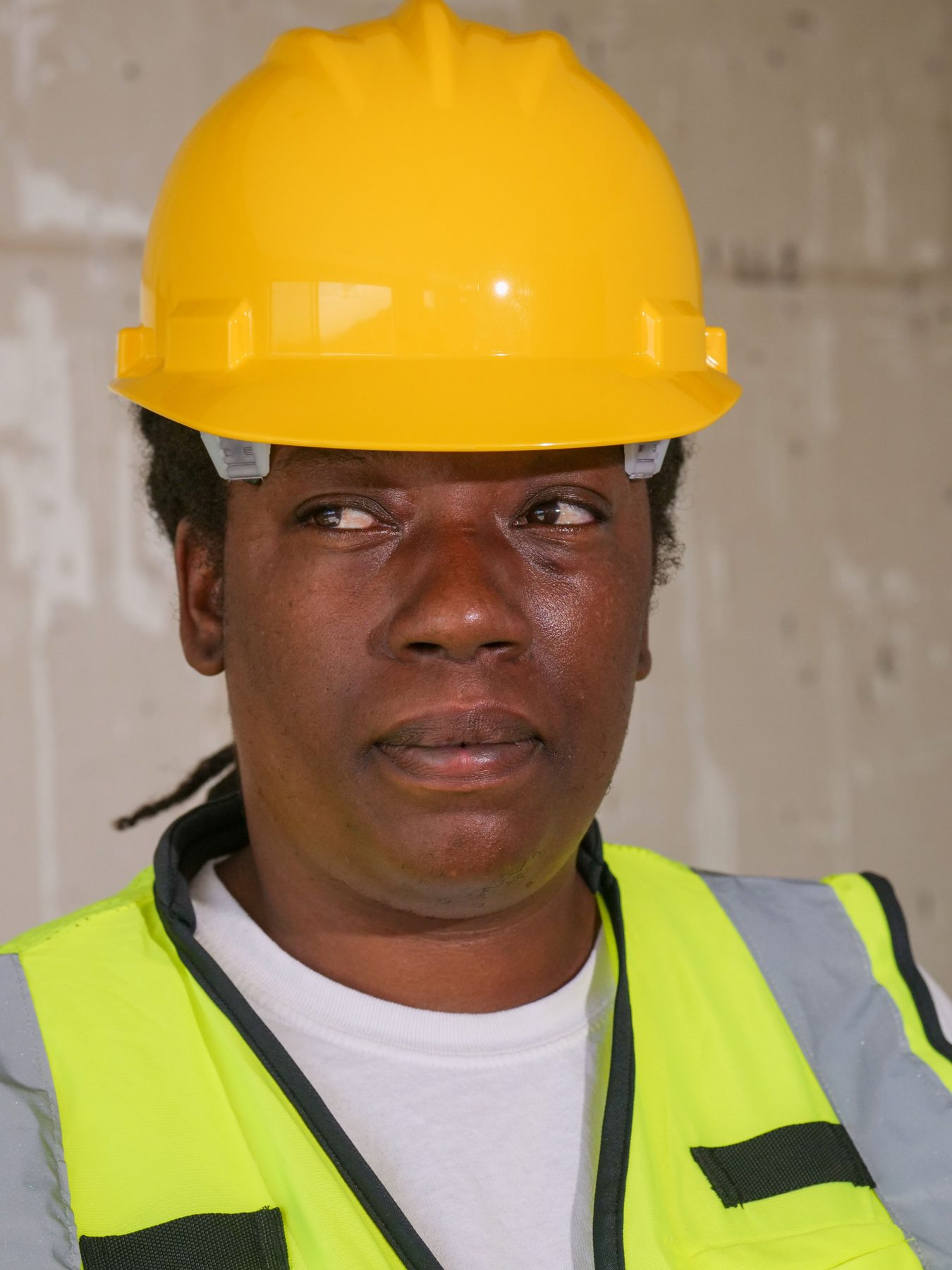 Mia, a Sunfield fitter in a yellow hard hat