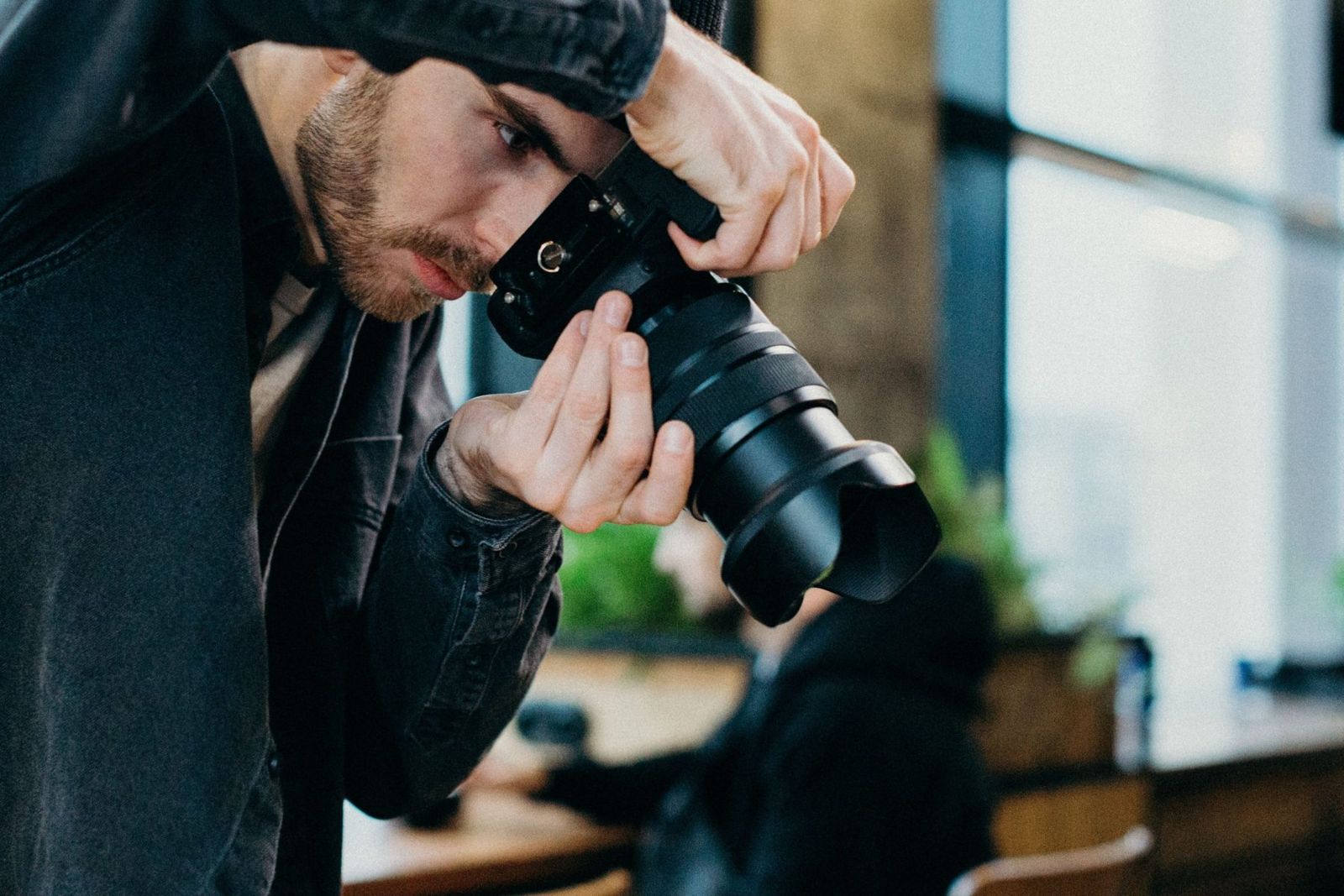 A photographer lining up a shot with a camera